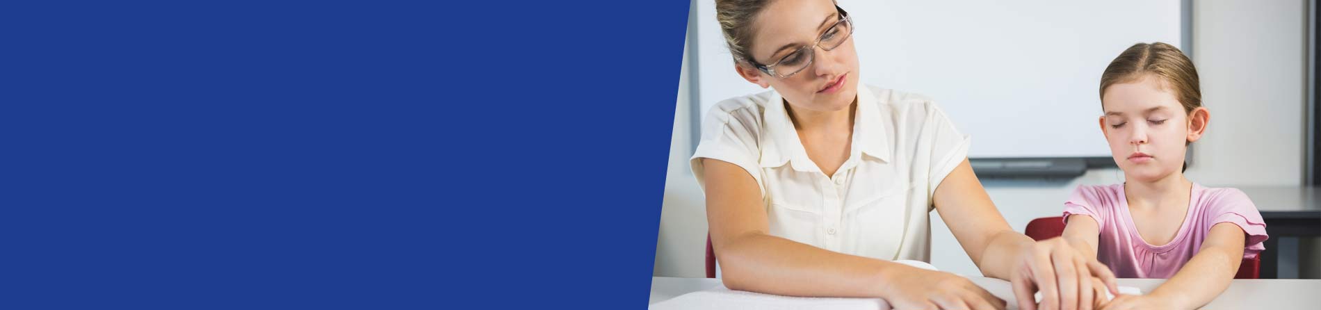 Teacher with a visually impaired child